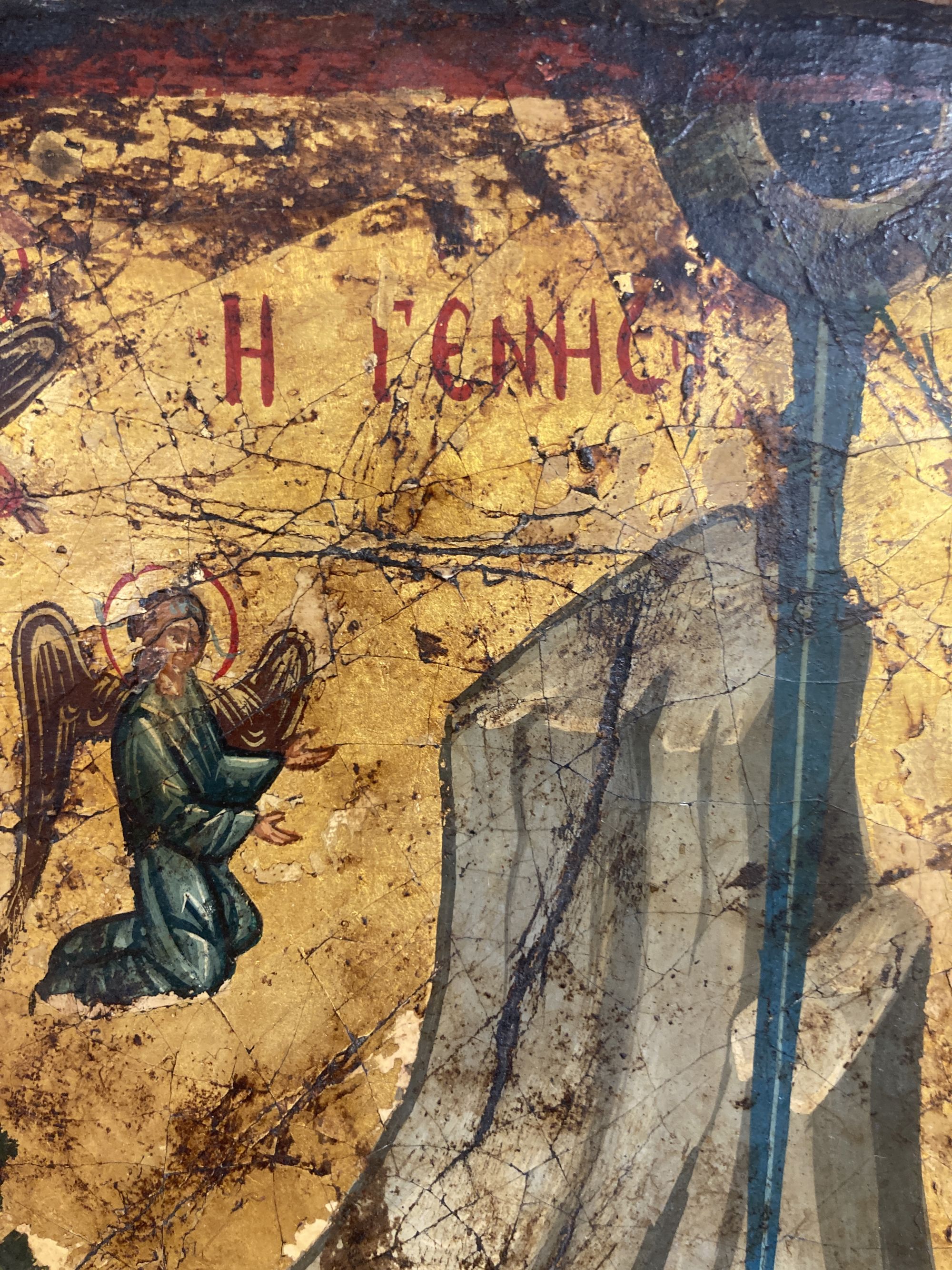 A 19th century tempera on panel icon, Virgin and child beneath a mountain with attendant figures, 36 x 30cm